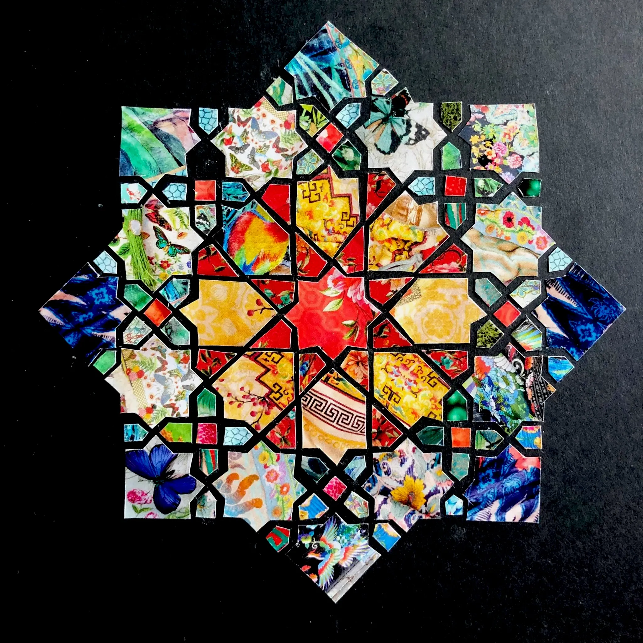 Islamic geometry design created with Johnny Was catalogue paper on a black background