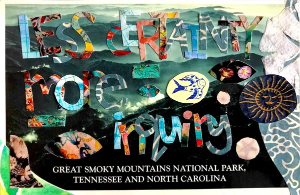the words 'Less certainty, more inquiry' cut out of paper on a postcard of the Great Smoky Mountains