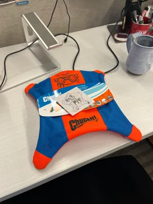 Giving Pip his flying squirrel toy