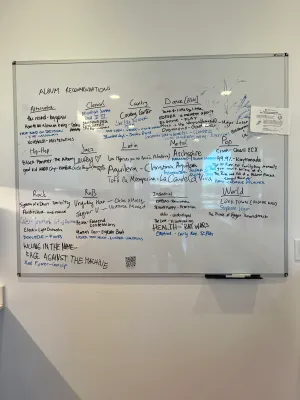 Album recommendations on lab whiteboard