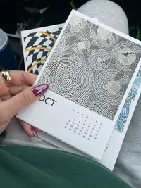 Reactions to my calendar, incl. J knowing I put my fave on October