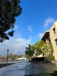 Surprise sunshine and rainbow on a rain-forecasted day
