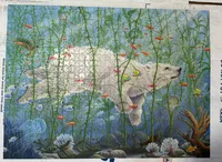 finishing puzzle of polar bear swimming without looking at the picture
