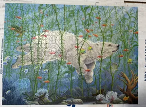 finishing puzzle of polar bear swimming without looking at the picture